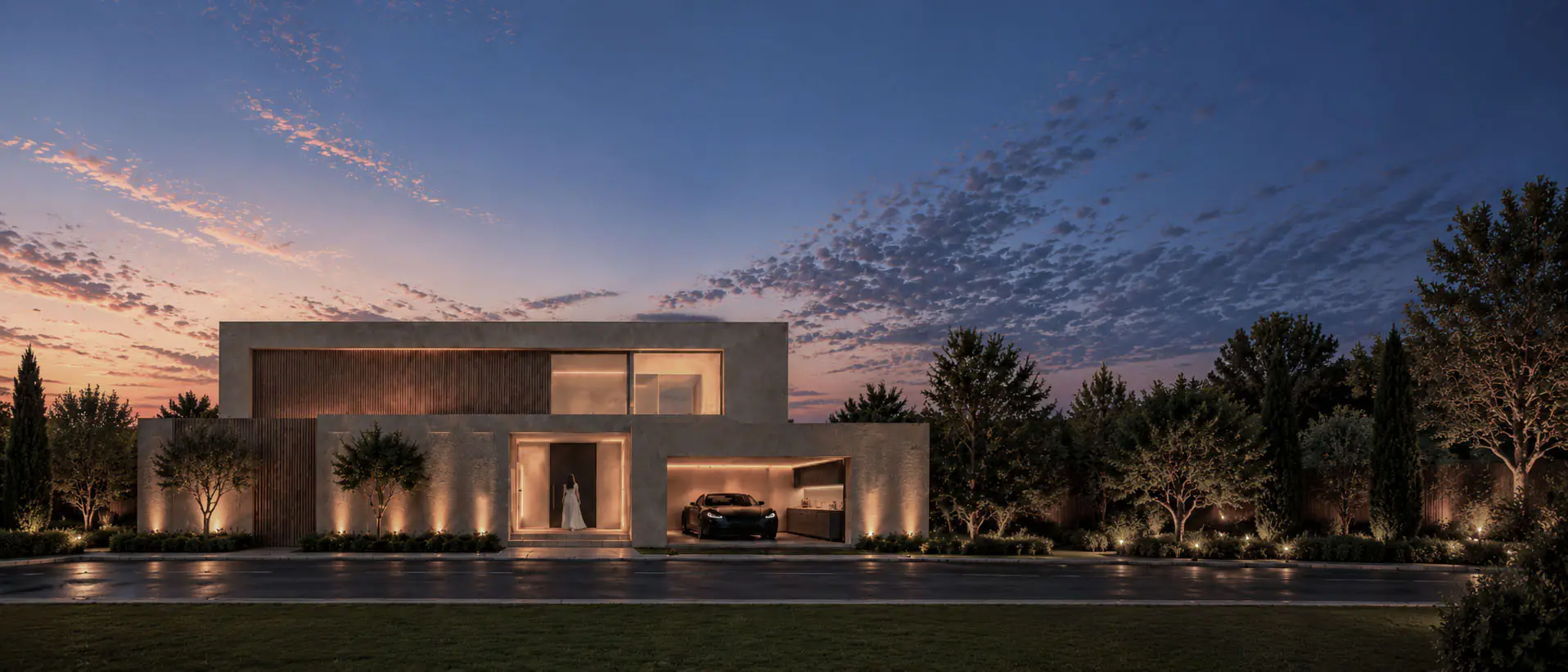 FBK House, İzmir: akşam ışığında aydınlatılmış giriş ve garajıyla sokak cephesi